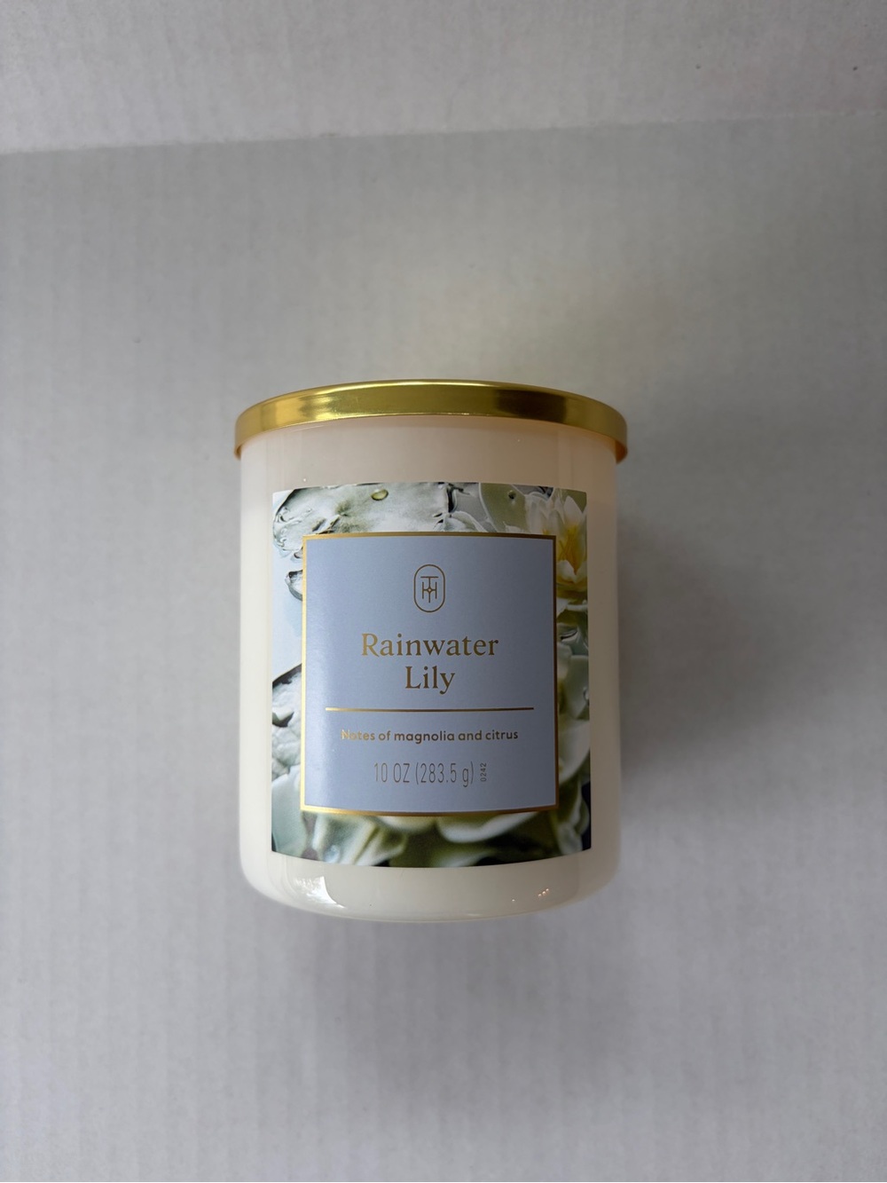 Threshold Rainwater Lily Scented Candle - White with Gold Lid